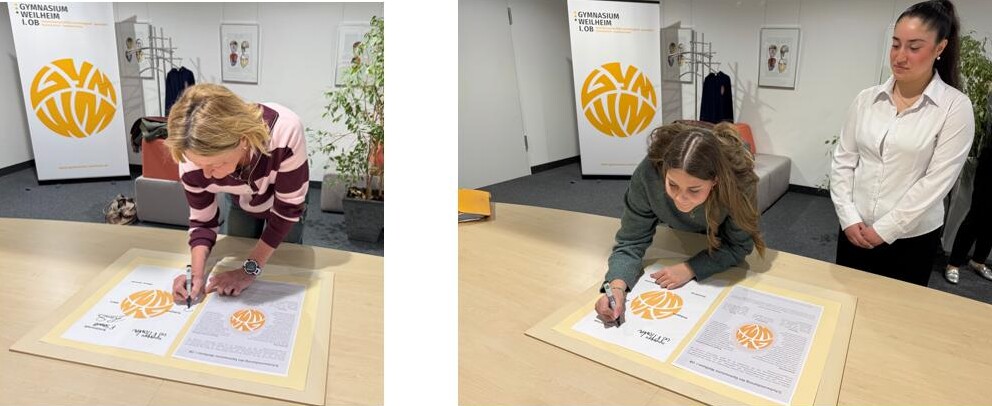 Zu sehen sind die Mitglieder Sch&uuml;lervertretung und des Personalrats bei der Unterzeichnung der Schulvereinbarung